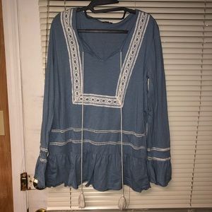 blue and white tunic with tassels